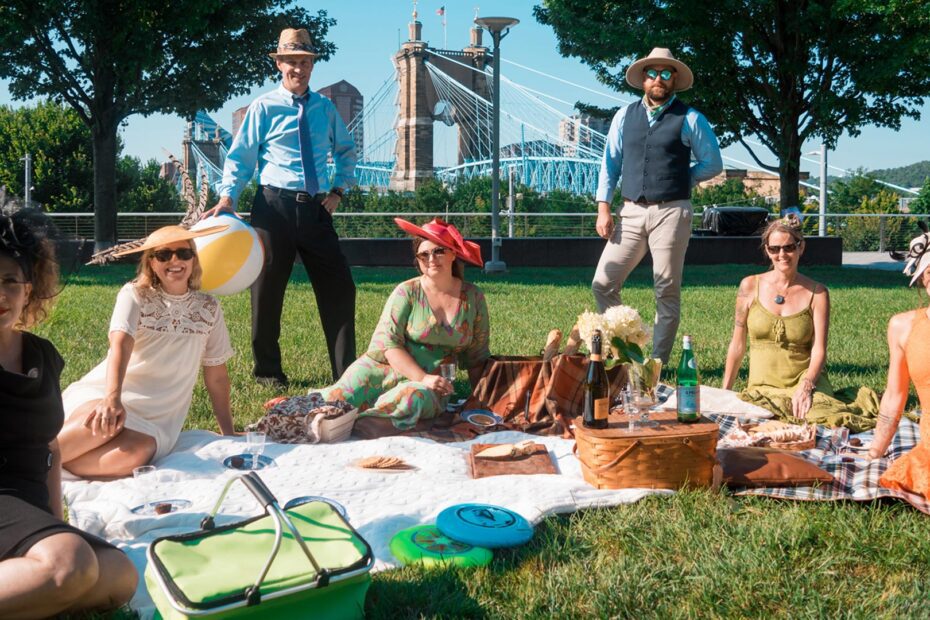 A group of people having a picnic in Smale Riverfront Park