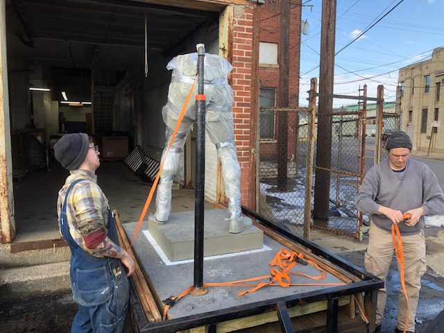 Ezzard statue being moved