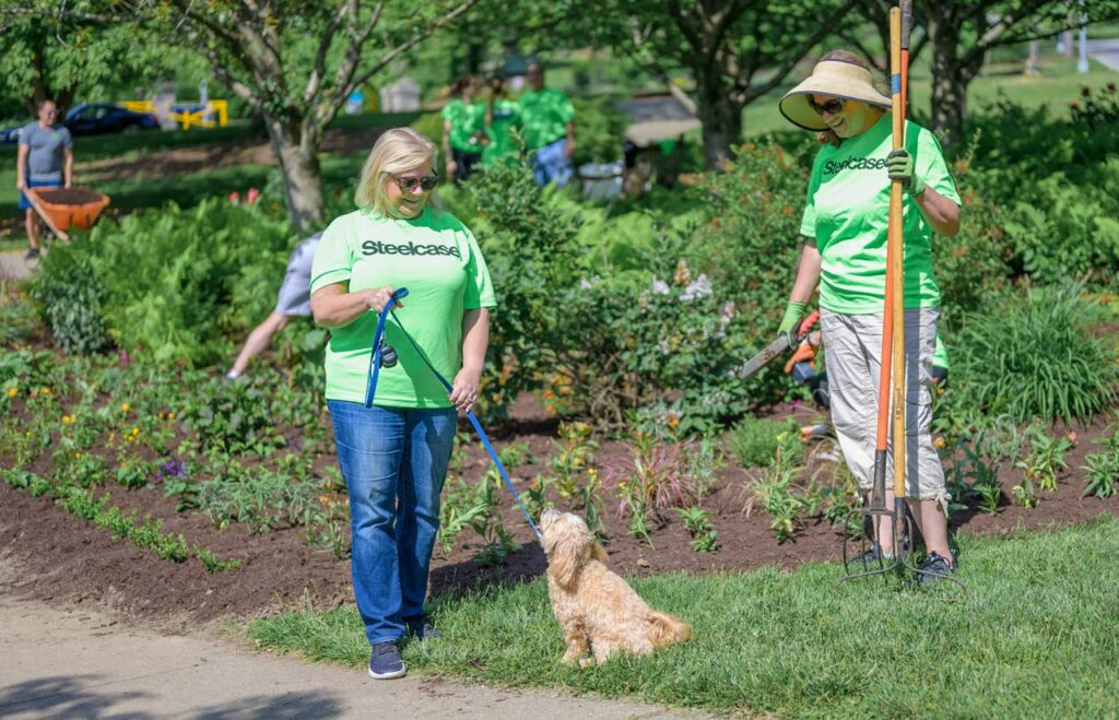 Steelcase volunteers at Eden Park planting flowers