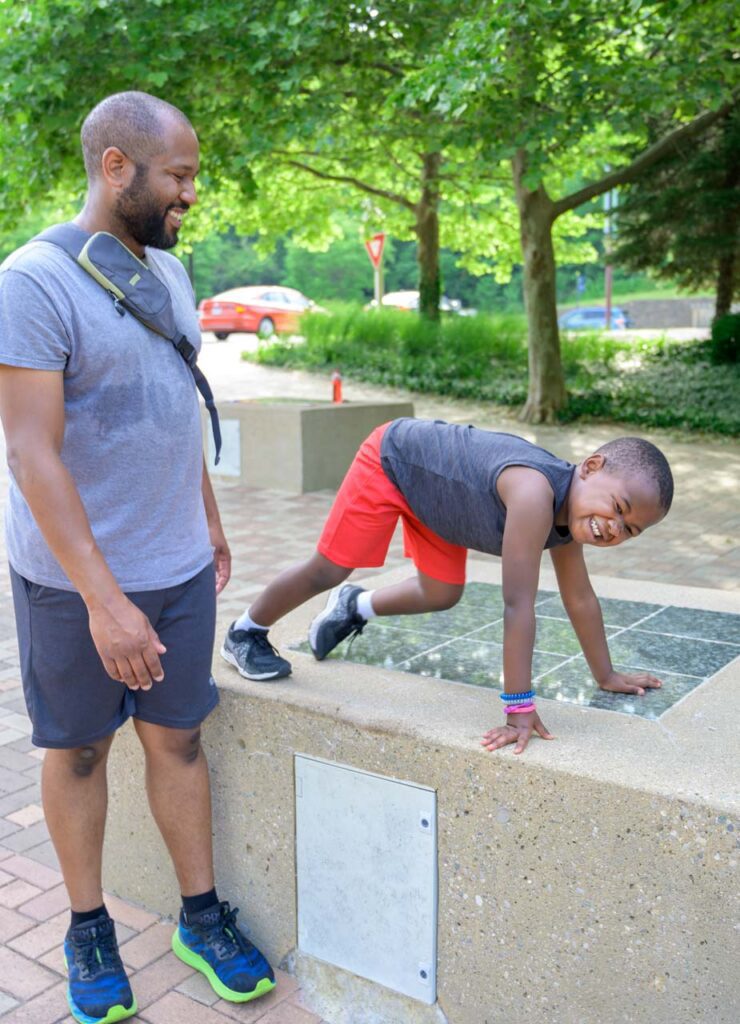 A be.well move athlete does some celebratory stretching after his run.