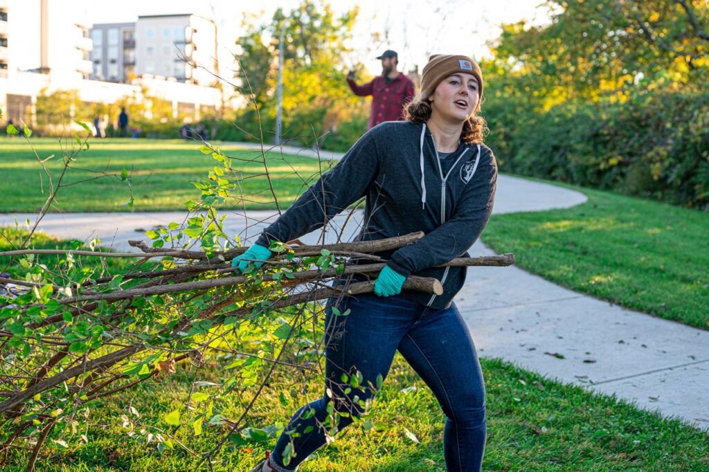 MadTree Brewing volunteers planting trees in Inwood Park near the PNC Grow Up Great Playground