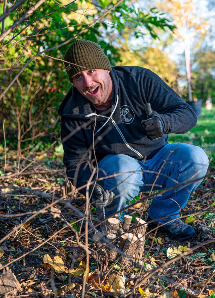 MadTree Brewing volunteers planting trees in Inwood Park near the PNC Grow Up Great Playground