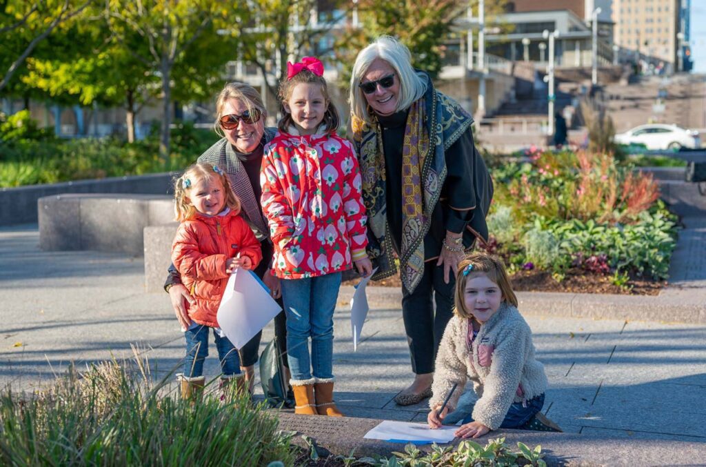 A family of women in the Smale Riverfront Park Women's Committee Garden