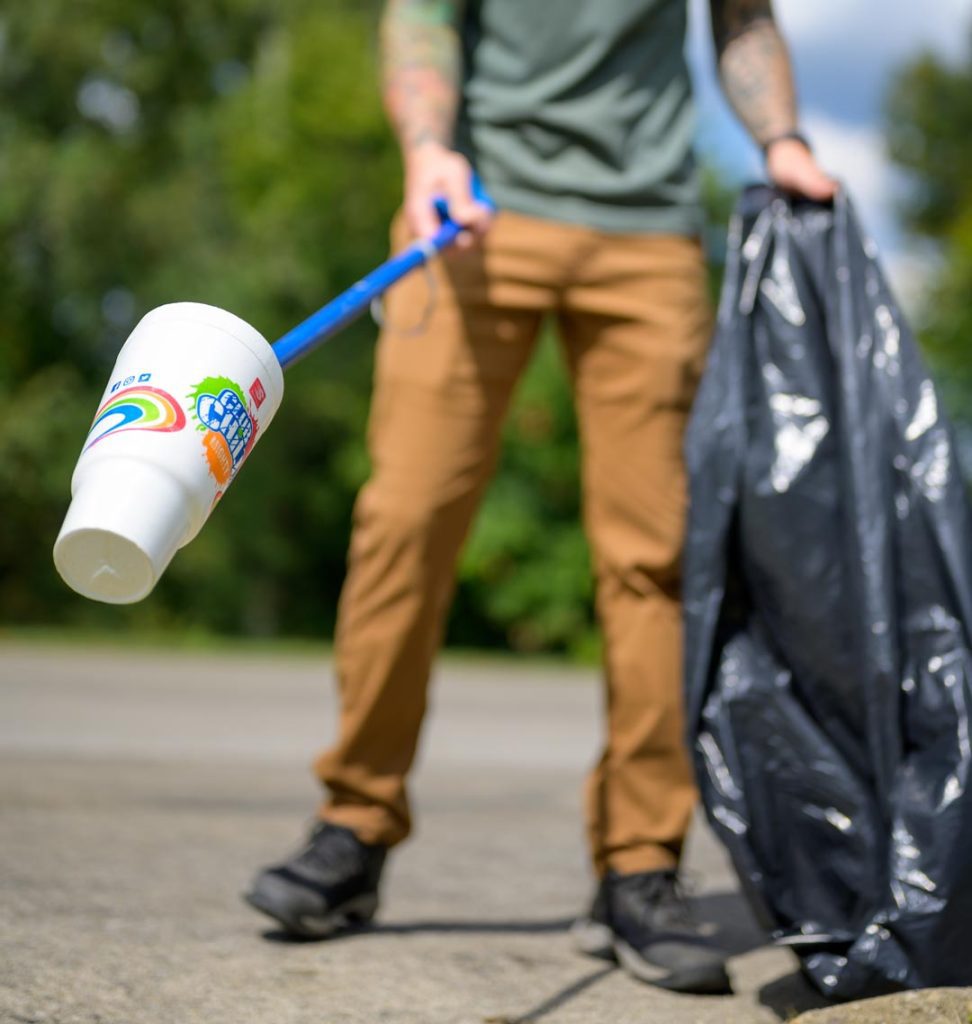 Person removing litter in Cincinnati Parks
