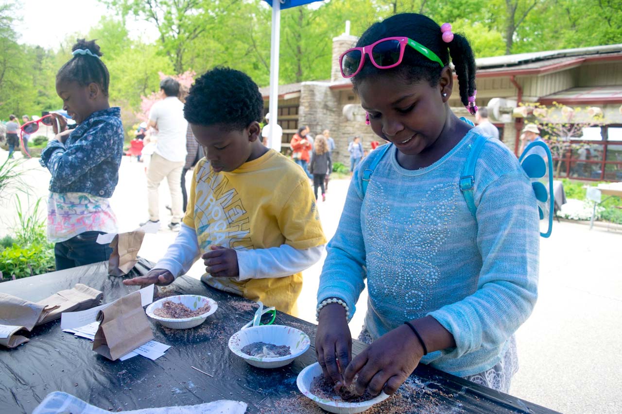 Children playing with a science experiment in a Cincinnati Park